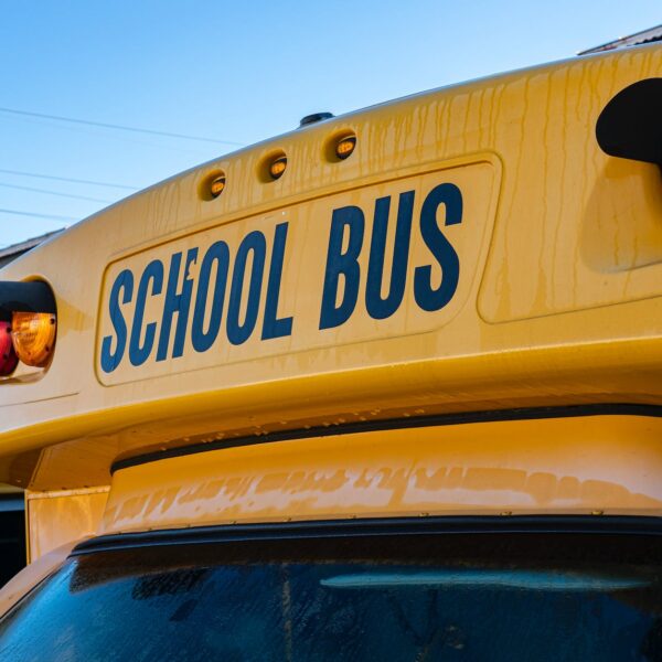 yellow school bus under blue sky
